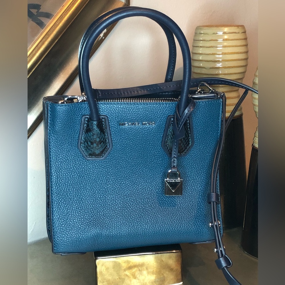 Michael Kors pebbled leather blue with snake print handles.